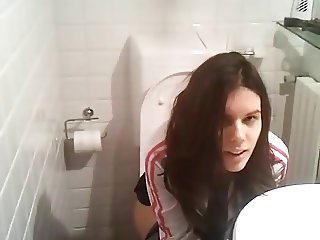Cute amateur filmed peeing on toilet by friend