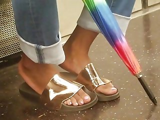 Candid ebony feet in ugly gold shoes